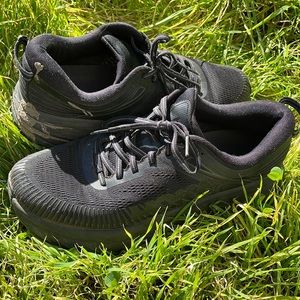 Black Hoka Ones running shoes